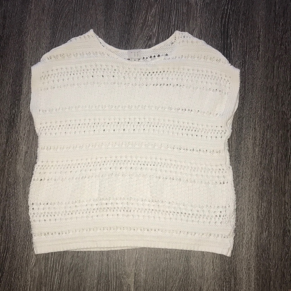 Loose white knit sweater